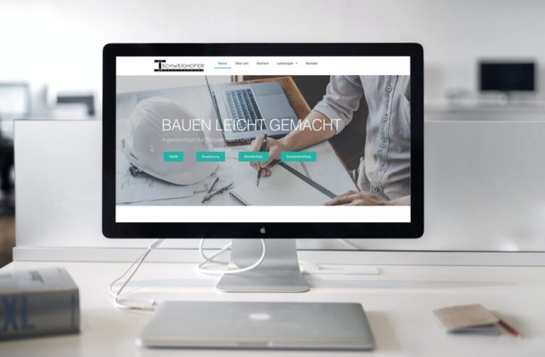 Website auf iMac am Schreibtisch